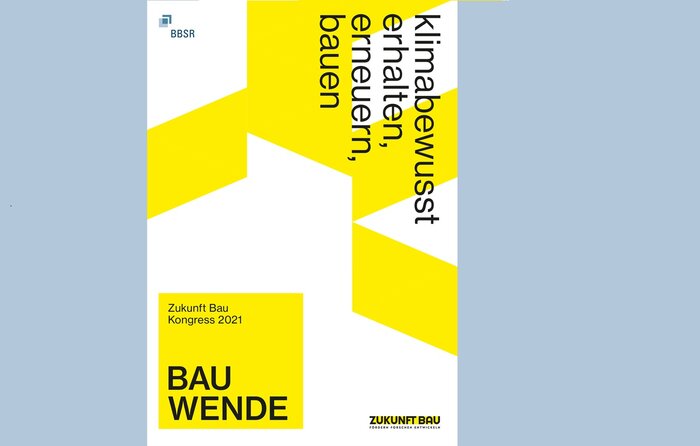 Cover "Zukunft Bau Kongress 2021: Bauwende", Überschrift in Schwarz senkrecht am rechten oberen Rand, Gelbe grafische Rhomben auf weißem Hintergrund